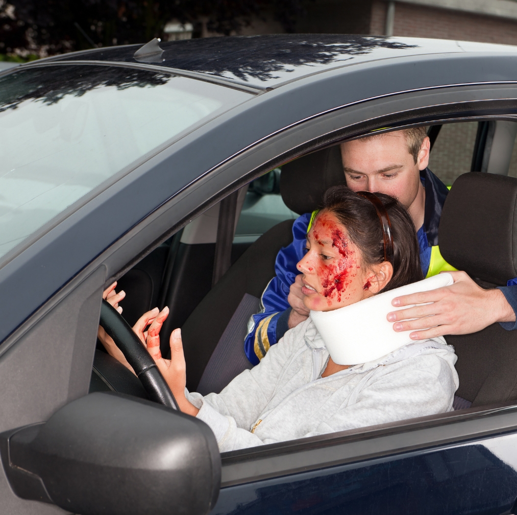 Injured woman in car crash getting a whiplash