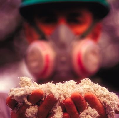 Worker showing asbestos in his hand