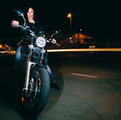 Lady night rider without helmet