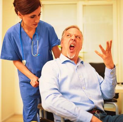Angry disabled patient at his nurse for giving him wrong medication