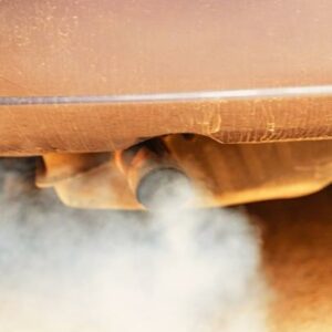 Diesel exhaust coming out from the car exhaust pipe