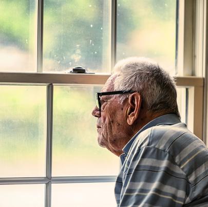 Elderly Senior Dementia Man Looking Through Grungy Window