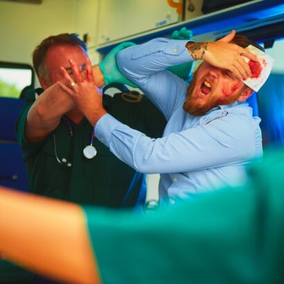 Paramedics trying to pacify abusive patient