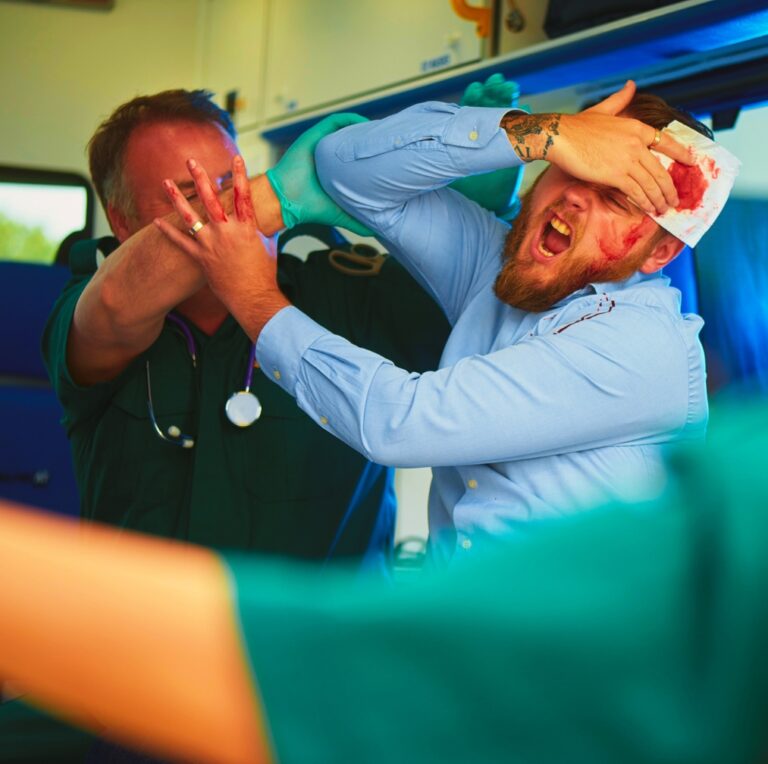 Paramedics trying to pacify abusive patient