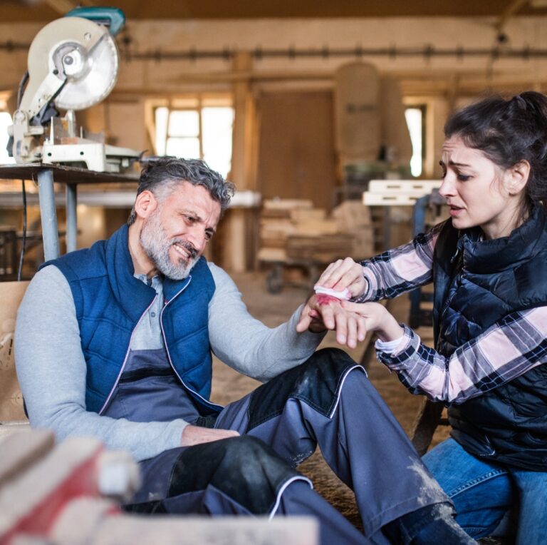 Craftswoman Helping Injured Colleague