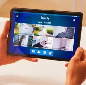 Man Watching Home Security Cameras in Tablet
