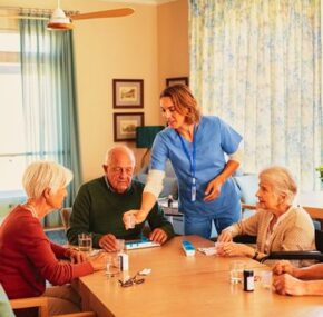 Nurse Giving Daily Medicine to Seniors at Nursing Home