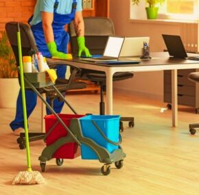 Male Housekeeper Cleaning in Office