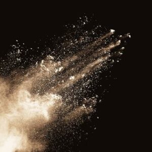 Combustible dust in workplace on black background