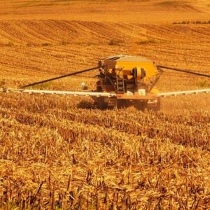 Spreading toxic agricultural chemical on wheat farm