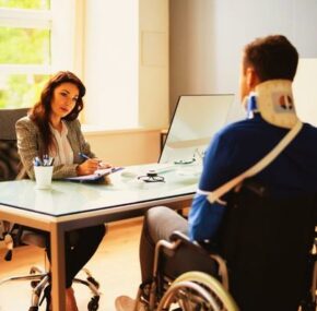 Injured Worker Talking with Lawyer about PRO Worker Injury And Disability Compensation