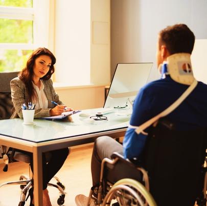 Injured Worker Talking with Lawyer about PRO Worker Injury And Disability Compensation