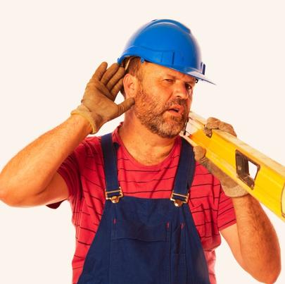 Worker suffering from hearing loss at workplace concept