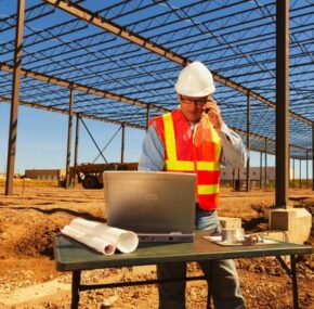 Construction worker using modern technology in construction site