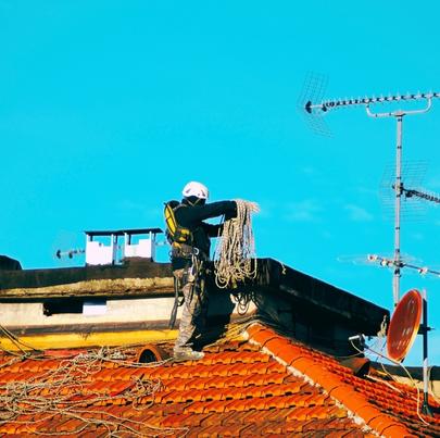 Worker ready to descend from rooftop