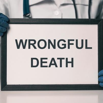 wrongful death sign being held by a doctor