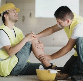Construction worker has an accident while working on new house. Concept of construction accidents