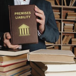 a man holding a law book about premises liability. concept of the attractive nuisance doctrine