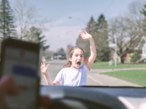 Young girl is about to get hit by distracted driver using a cell phone while driving. What to Do if You Get Hit by a Car as a Pedestrian.
